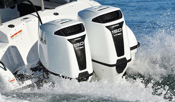 Two honda outboards creating wake