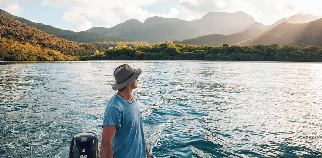 Man on boat on lake in Hinchinbrook Island
