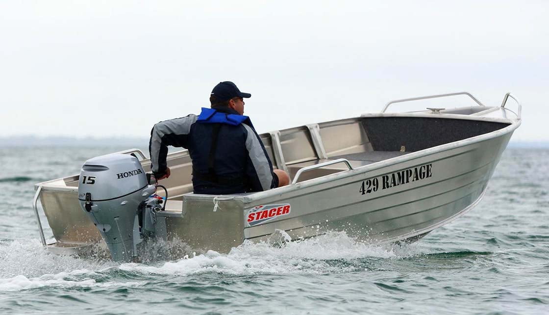 Man at motor in tinnie