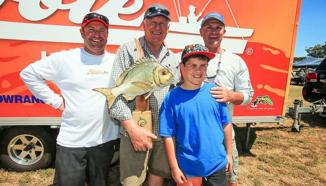 Fishing tournament winners including Al McGlashan holding fish